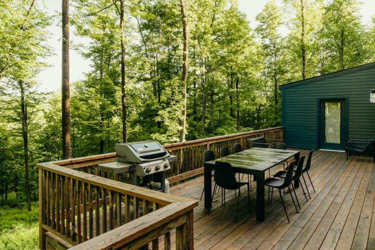Outdoor wood deck with seating beside a home