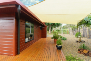 Wood deck and outdoor living area beside a modern home