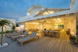 Coastal home with an outdoor deck and seating