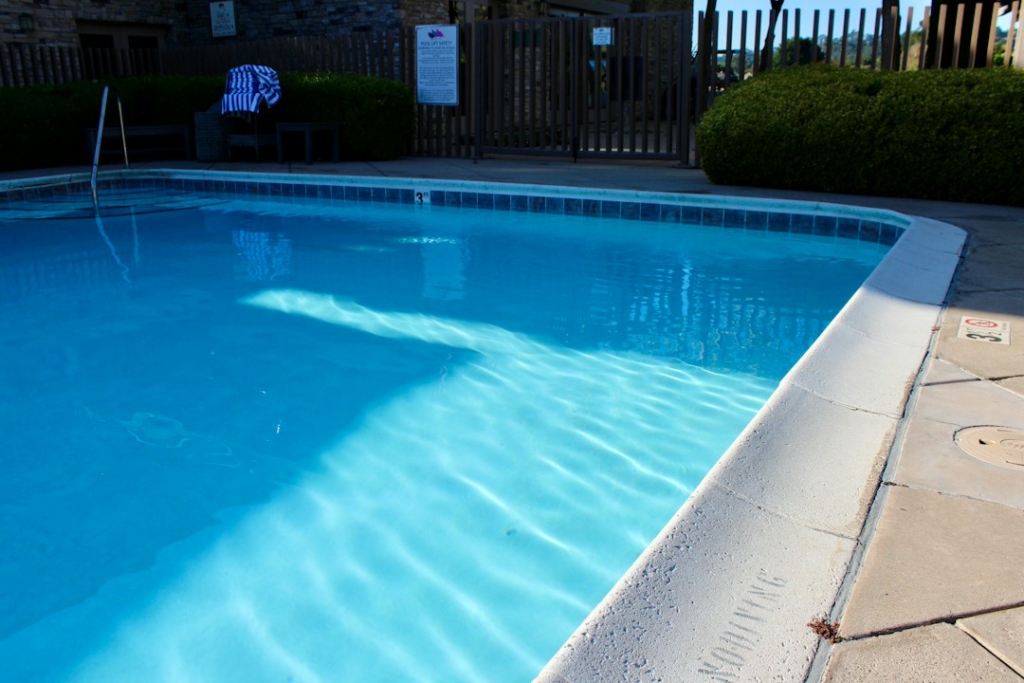 Bright residential swimming pool and surrounding deck