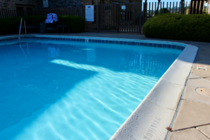 Bright residential swimming pool and surrounding deck