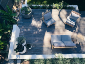 Aerial view of a deck with outdoor furniture and planters