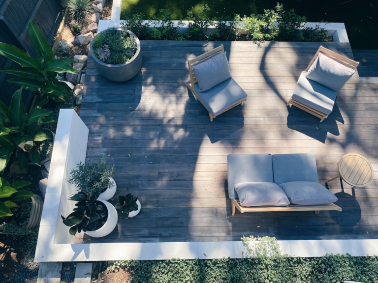Aerial view of a deck with outdoor furniture and planters