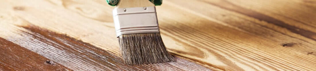 Freshly stained wood deck with railing
