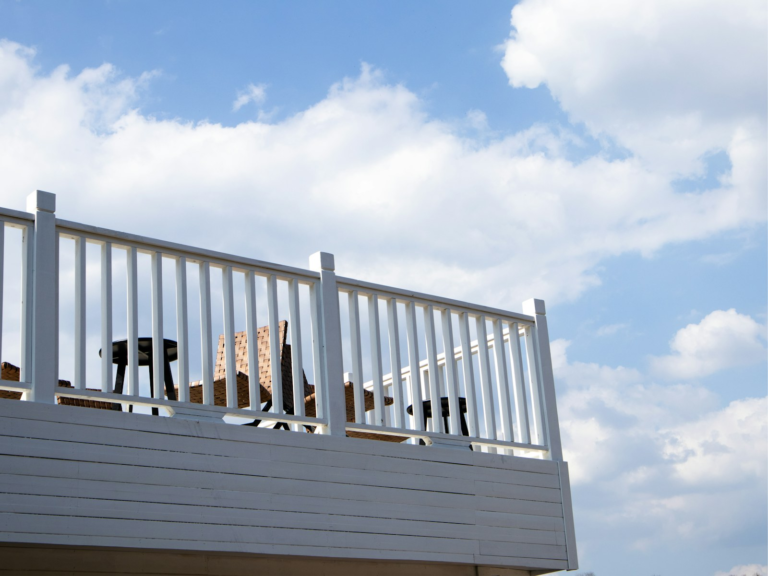 Finished light-colored residential deck with outdoor chairs. Photo by 三山 on Unsplash.